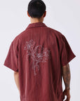 Chemise à motif rayé avec broderie au dos