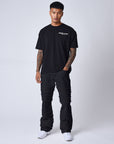 Jeans évasé à détails effilochés